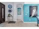 Inviting foyer with teal accent wall, decorative plates, and stylish decor, creating a welcoming entrance at 14741 E Mountain Majesty --, Fountain Hills, AZ 85268