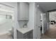 Hallway featuring gray cabinets with marble counter, providing ample storage near bathroom at 14741 E Mountain Majesty --, Fountain Hills, AZ 85268