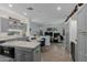 Open-concept kitchen with gray cabinets, a breakfast nook, and an adjacent living area for seamless entertaining at 14741 E Mountain Majesty --, Fountain Hills, AZ 85268