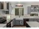 Well-lit kitchen features stainless steel appliances, gray cabinetry, and an undermount sink overlooking an outdoor space at 14741 E Mountain Majesty --, Fountain Hills, AZ 85268