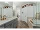 This bathroom includes tile floors, double vanities, and a soaking tub with a glass block window at 14741 E Mountain Majesty --, Fountain Hills, AZ 85268