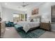 Bright main bedroom features a ceiling fan, carpeted floors, a king bed, and a sitting area at 14741 E Mountain Majesty --, Fountain Hills, AZ 85268