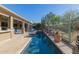 Lush backyard with pool, covered patio, and desert landscaping at 14741 E Mountain Majesty --, Fountain Hills, AZ 85268
