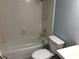 Neutral toned bathroom features a standard shower and bathtub combination with basic fixtures and tiling at 15402 N 28Th St # 112, Phoenix, AZ 85032