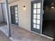 Outdoor patio featuring French doors offering an indoor-outdoor living experience at 15402 N 28Th St # 112, Phoenix, AZ 85032