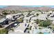 Aerial view showcasing the community pool and community buildings with desert landscaping at 16013 S Desert Foothills Pkwy # 1133, Phoenix, AZ 85048