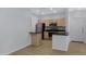 Modern kitchen features wood cabinets, stainless steel appliances, and a breakfast bar at 16013 S Desert Foothills Pkwy # 1133, Phoenix, AZ 85048