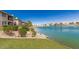 Scenic view of a lakefront property with lush green landscaping at 16013 S Desert Foothills Pkwy # 1133, Phoenix, AZ 85048