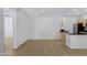 Well-lit living room shows wood floors, opening into the kitchen area for easy living at 16013 S Desert Foothills Pkwy # 1133, Phoenix, AZ 85048