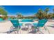 Relaxing pool area with lounge chairs and palm trees for a resort-style feel at 16013 S Desert Foothills Pkwy # 1133, Phoenix, AZ 85048