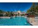 Beautiful community pool with stone pillar water features and inviting lounge areas at 16013 S Desert Foothills Pkwy # 1133, Phoenix, AZ 85048