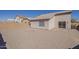The backyard features a low brick fence, gravel, and a patio at 1615 W Hidalgo Ave, Phoenix, AZ 85041