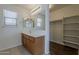 Functional bathroom with large mirror and storage offers a clean, well-lit space at 1615 W Hidalgo Ave, Phoenix, AZ 85041
