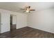 Bedroom featuring a ceiling fan, wood-look flooring, and direct access to other rooms in the home at 1615 W Hidalgo Ave, Phoenix, AZ 85041