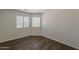 This bedroom offers natural light, neutral walls, and hardwood floors at 1615 W Hidalgo Ave, Phoenix, AZ 85041