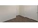 This bedroom features hardwood floors, white walls, and a spacious closet for ample storage at 1615 W Hidalgo Ave, Phoenix, AZ 85041