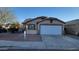 Charming single-story home featuring desert landscaping and a two-car garage at 1615 W Hidalgo Ave, Phoenix, AZ 85041