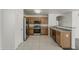 Well-lit kitchen with stainless steel appliances and wooden cabinets offers both style and functionality at 1615 W Hidalgo Ave, Phoenix, AZ 85041