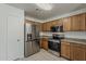Well-equipped kitchen featuring stainless steel appliances and ample cabinet space for storage and cooking at 1615 W Hidalgo Ave, Phoenix, AZ 85041