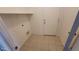 This laundry room has shelving for organizing at 1615 W Hidalgo Ave, Phoenix, AZ 85041