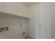 A well lit laundry area with shelving at 1615 W Hidalgo Ave, Phoenix, AZ 85041