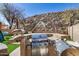 Outdoor kitchen with stone counter, stainless steel grill, pizza oven, and scenic views at 16834 S 20Th Pl, Phoenix, AZ 85048