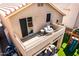 Relaxing balcony with comfortable seating, a small table, and sliding glass door access at 16834 S 20Th Pl, Phoenix, AZ 85048