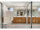 Bright bathroom features a bathtub, large mirror, and vanity with wood cabinets at 16834 S 20Th Pl, Phoenix, AZ 85048