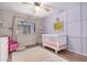 Bright Bedroom with modern furniture and decor, ceiling fan, and an abundance of natural light at 16834 S 20Th Pl, Phoenix, AZ 85048