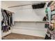 Walk-in closet offers ample storage with built-in shelving and hanging rods for clothes and shoes at 16834 S 20Th Pl, Phoenix, AZ 85048