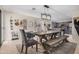 Charming dining area featuring a farmhouse table and decorative wall accents at 16834 S 20Th Pl, Phoenix, AZ 85048