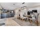 Open-concept dining area with stylish lighting and convenient access to the kitchen at 16834 S 20Th Pl, Phoenix, AZ 85048