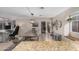 Open dining area with modern lighting, a large dining table, and seamless access to the backyard at 16834 S 20Th Pl, Phoenix, AZ 85048