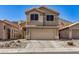 Inviting two-story home with a two-car garage, desert landscaping, and mountain views at 16834 S 20Th Pl, Phoenix, AZ 85048