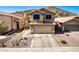 Charming two-story home with a well-maintained front yard and inviting curb appeal, featuring a two-car garage at 16834 S 20Th Pl, Phoenix, AZ 85048