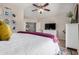 Bright main bedroom with modern furniture and decor, ceiling fan, and an abundance of natural light at 16834 S 20Th Pl, Phoenix, AZ 85048