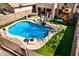 Inviting backyard pool with pristine landscaping, an outdoor kitchen, lounge chairs, and a playground at 16834 S 20Th Pl, Phoenix, AZ 85048