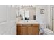 Bathroom featuring a white toilet and a wood vanity with white countertop at 16913 W Cortaro Point Dr, Surprise, AZ 85387