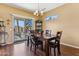 Charming dining area with backyard access and stylish decor at 16913 W Cortaro Point Dr, Surprise, AZ 85387