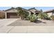 Charming single-story home featuring desert landscaping and a two-car garage at 16913 W Cortaro Point Dr, Surprise, AZ 85387