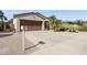 Well-maintained home with desert landscaping, concrete driveway, and attached garage at 16913 W Cortaro Point Dr, Surprise, AZ 85387