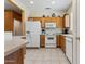 Efficient kitchen with essential appliances and ample cabinet space at 16913 W Cortaro Point Dr, Surprise, AZ 85387