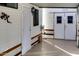 Carport featuring a white door and a garage storage area at 17200 W Bell Rd # 2221, Surprise, AZ 85374