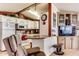 Stylish kitchen with a breakfast bar, white appliances, and convenient access to living room at 17200 W Bell Rd # 2221, Surprise, AZ 85374