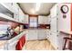 Bright kitchen featuring ample counter space, crisp white cabinets, and a large window for natural light at 17200 W Bell Rd # 2221, Surprise, AZ 85374