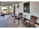 Covered porch features seating, sliding glass door, and neutral finishes at 17200 W Bell Rd # 2221, Surprise, AZ 85374