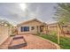 Charming backyard with a well-maintained play area and cozy patio seating, great for outdoor relaxation at 17526 W Coyote Trail Dr, Goodyear, AZ 85338