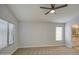 Spacious bedroom with carpet and large windows at 17526 W Coyote Trail Dr, Goodyear, AZ 85338