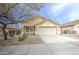 Charming single-story home with desert landscaping, a two-car garage, and a welcoming facade at 17526 W Coyote Trail Dr, Goodyear, AZ 85338