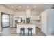Modern kitchen island with butcher block countertop, stainless steel appliances, and ample cabinet space at 17526 W Coyote Trail Dr, Goodyear, AZ 85338